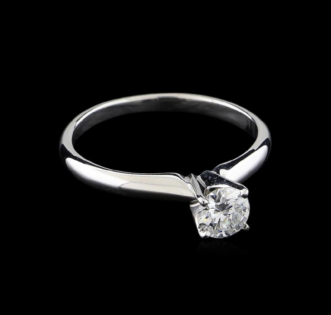 0.44 ctw Diamond Solitaire Ring - 14KT White Gold: One electronically tested 14KT white gold ladies cast diamond solitaire ring with a bright polish finish. The featured diamond is completed by a one millimeter wide band. Identified with markings of "
