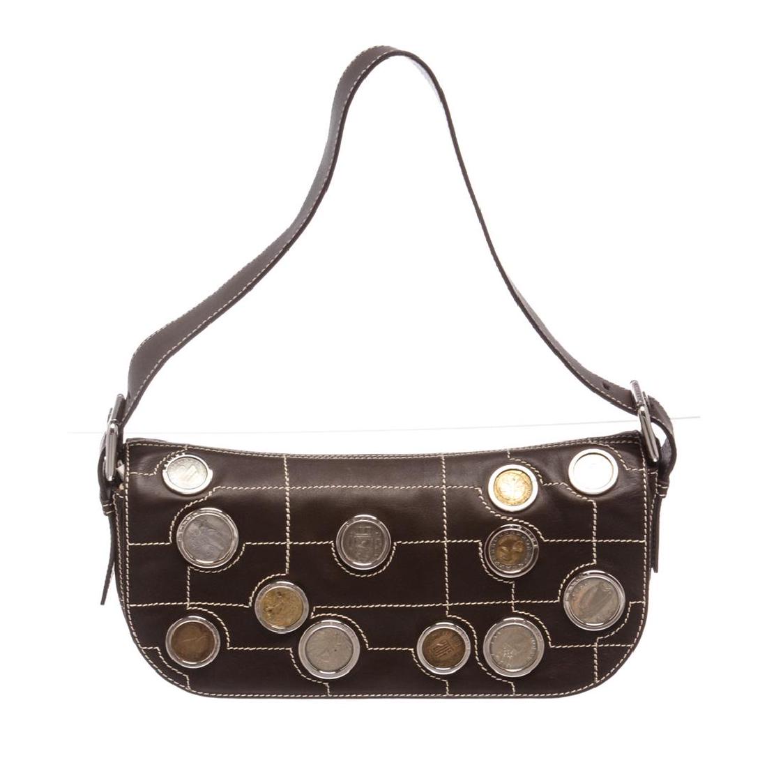 Celine Dark Brown Leather Eurodyssey Coin Collection: From the January 1st 2002 Eurodyssey limited edition collection comes this Celine shoulder handbag. Overall flap magnetic snap closure. With twelve European minted retired coins at front flap. Interio