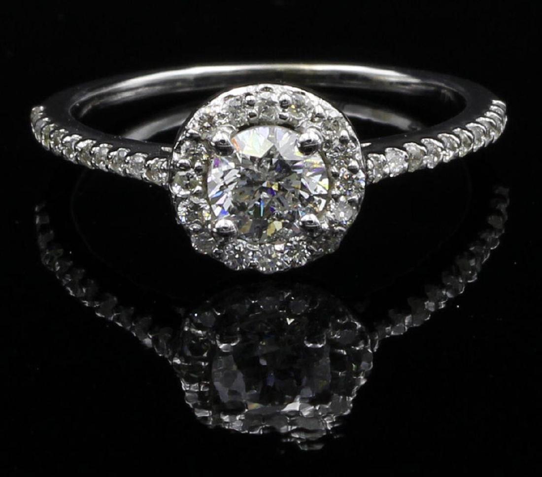 0.63 ctw Diamond Wedding Ring - 14KT White Gold: One lady's ring featuring: 14KT white gold weighing 1.81 grams containing one center diamond weighing 0.42ct and 38 side diamonds weighing 0.21ctw. The center diamond is round brilliant cut with SI2 c