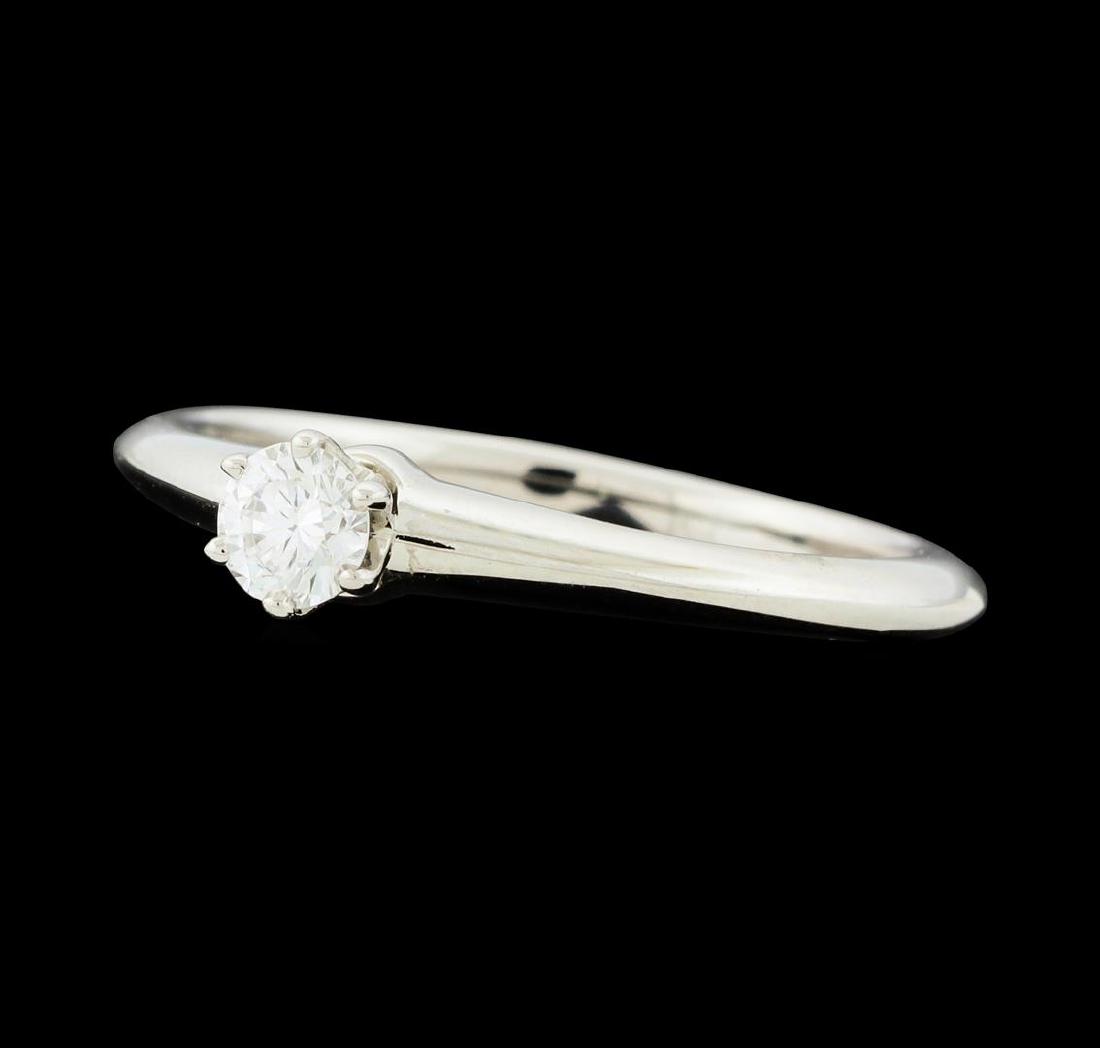 0.19 ctw Diamond Ring - Platinum: One electronically tested platinum lady's cast wedding ring with a cathedral solitaire with a bright polish finish. The featured lady's ring has a knife-edge shank measuring 1.85 millimeters wide. Tra
