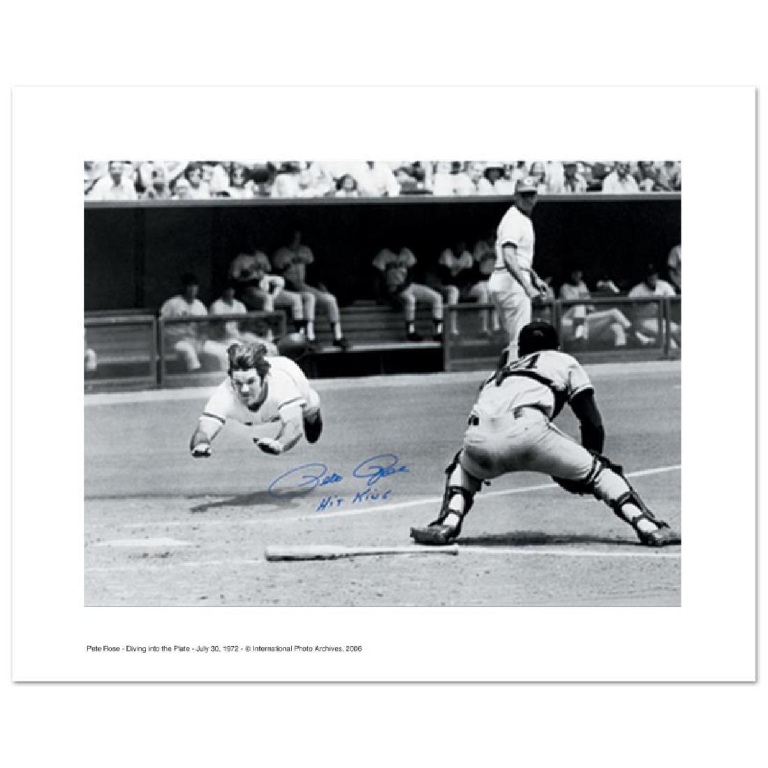 Pete Rose Diving by Rose, Pete: "Pete Rose Diving Into The Plate" is an archival photograph featuring the legendary baseball player diving safely into home plate! This photo was taken on July 30, 1972 and is autographed boldly by Pe
