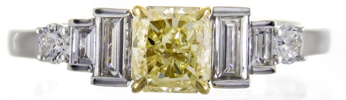 1.01 ctw Fancy Yellow Diamond Ring - 18KT Two-Tone Gold: One ring featuring: 18KT Two-Tone Gold weighing 3.67 grams containing one princess cut Fancy Yellow Diamond with a total weight of 1.01 ct and diamonds weighing a total of 0.50 ctw. GIA Appraised.