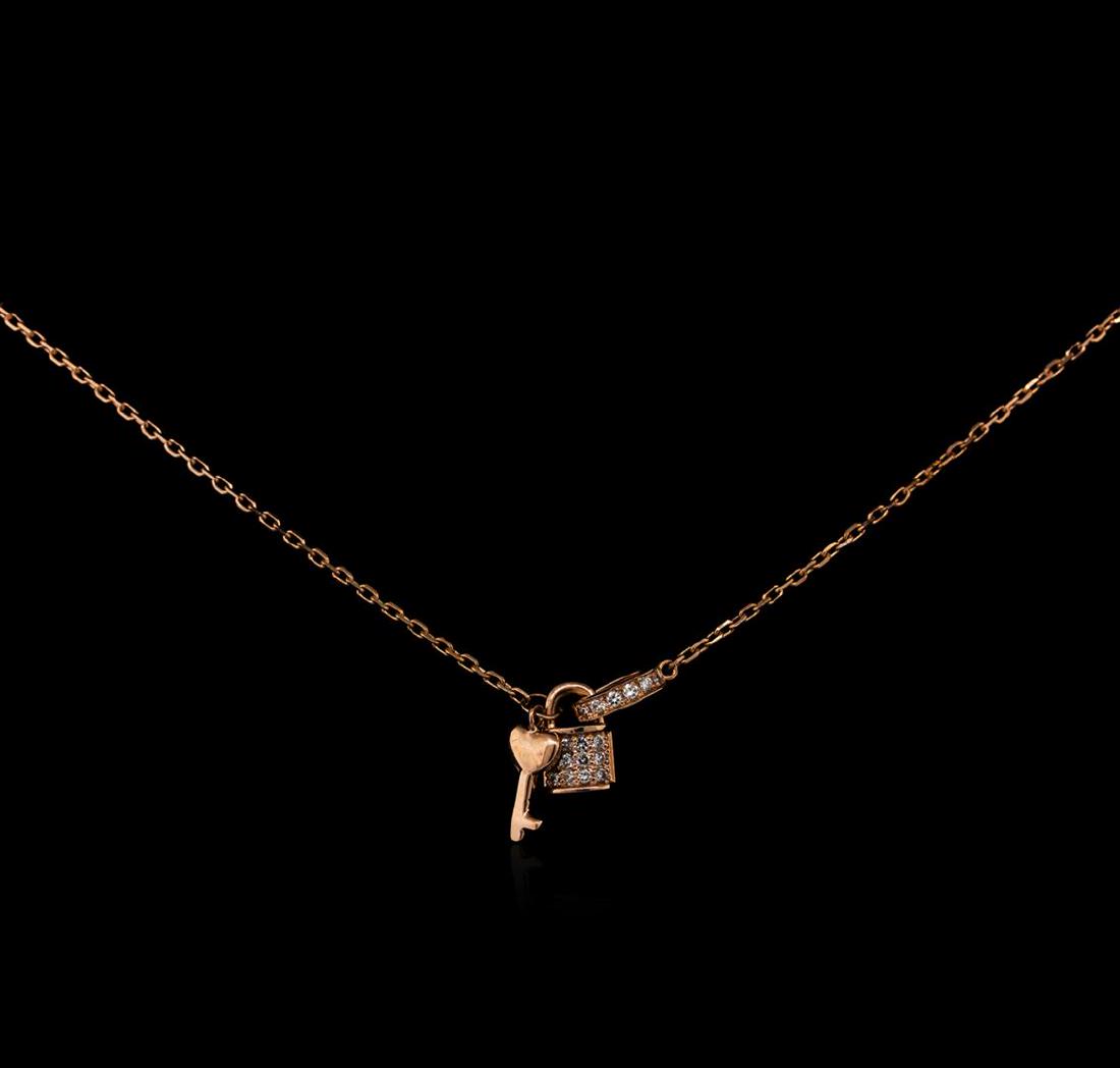 0.12 ctw Diamond Lock and Key Pendant With Chain - 14KT: One lock and key pendant with chain featuring: 14KT rose gold weighing 2.70 grams containing diamonds with a total weight of 0.12ct.