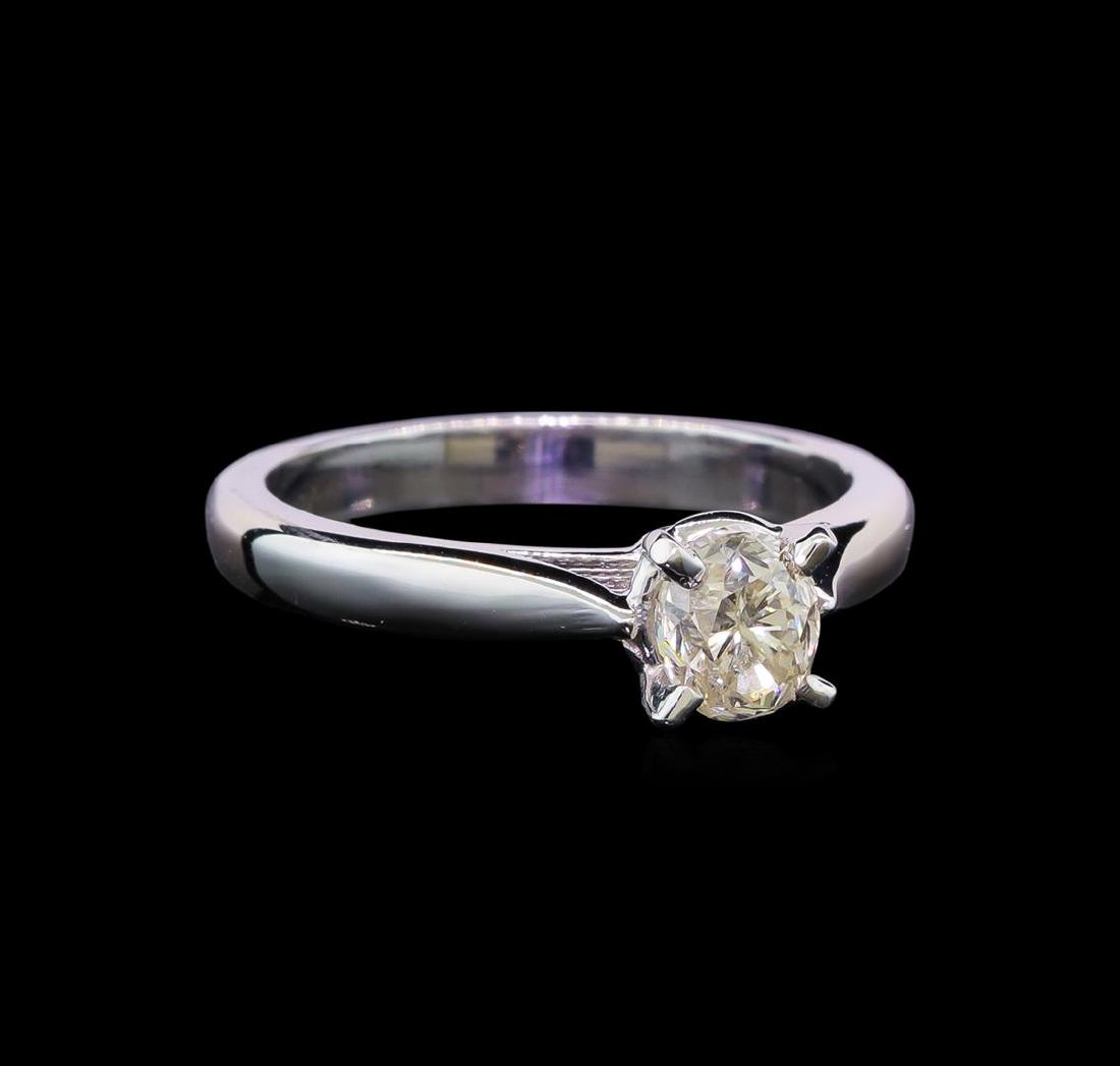 14KT White Gold 0.80 ctw Oval Cut Diamond Solitaire: One electronically tested 14KT white gold ladies cast diamond solitaire ring with a cathedral shank with a bright polish finish. Identified with markings of "14K". Condition is new. Containing: One pr