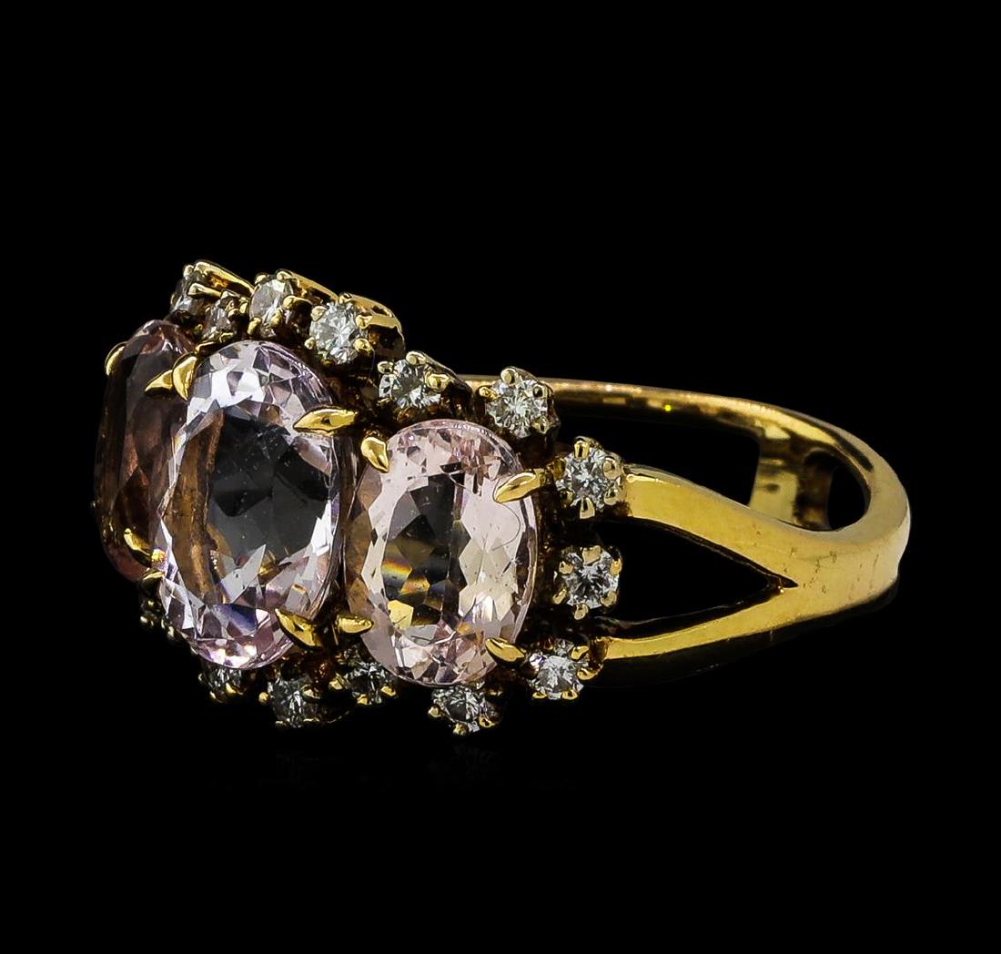 4.72 ctw Morganite and Diamond Ring - 18KT Rose Gold: One electronically tested 18KT rose gold ladies cast morganite and diamond ring. The ring features a series of three morganites set within a diamond bezel supported by split shoulders, completed by a 