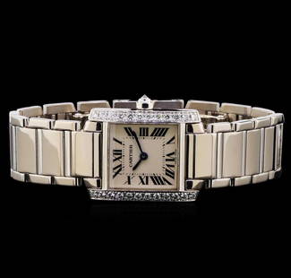 Cartier 18KT White Gold Watch: One Cartier watch featuring: Case: rounded rectangle, 25mm x 20mm, 18KT white gold, diamond set edges. Dial: White with black Roman numerals, blue pointed hands. Movement: Automatic. Crystal: Sapphire
