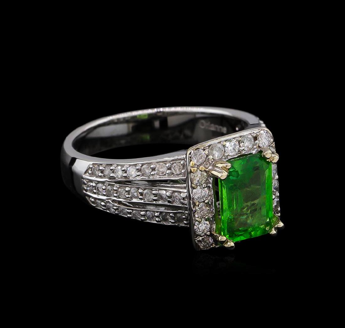 1.91 ctw Tsavorite and Diamond Ring - 14KT White Gold: One electronically tested 14KT white gold lady's cast fashion ring with a three row split shank halo with a bright polish finish. The featured lady's ring has a shank measuring 3.75 millimeters wide.