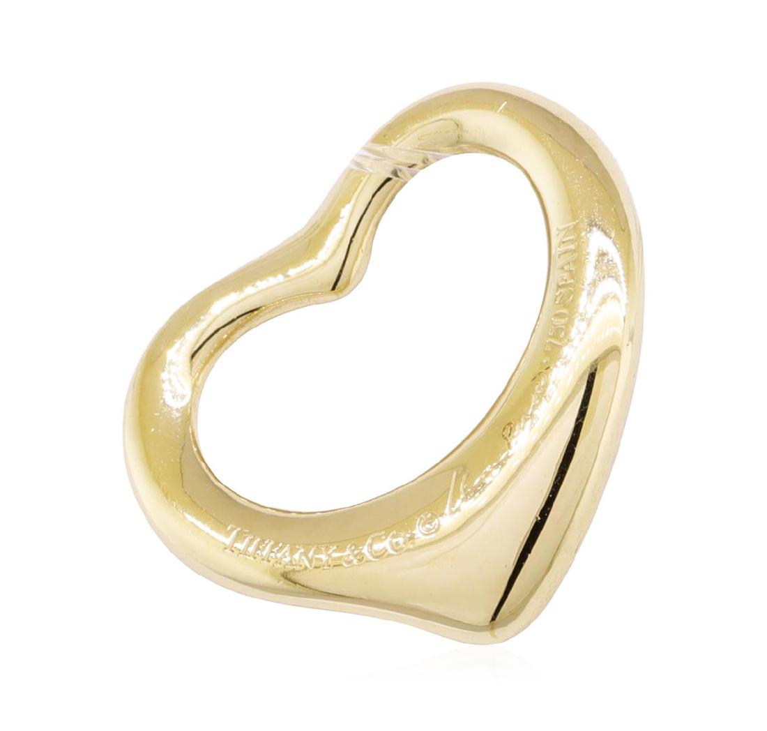 Tiffany and Company Elsa Peretti Open Heart Pendant -: One Tiffany and Company Elsa Peretti Open Heart pendant featuring: 18KT yellow gold weighing 2.4 grams.
