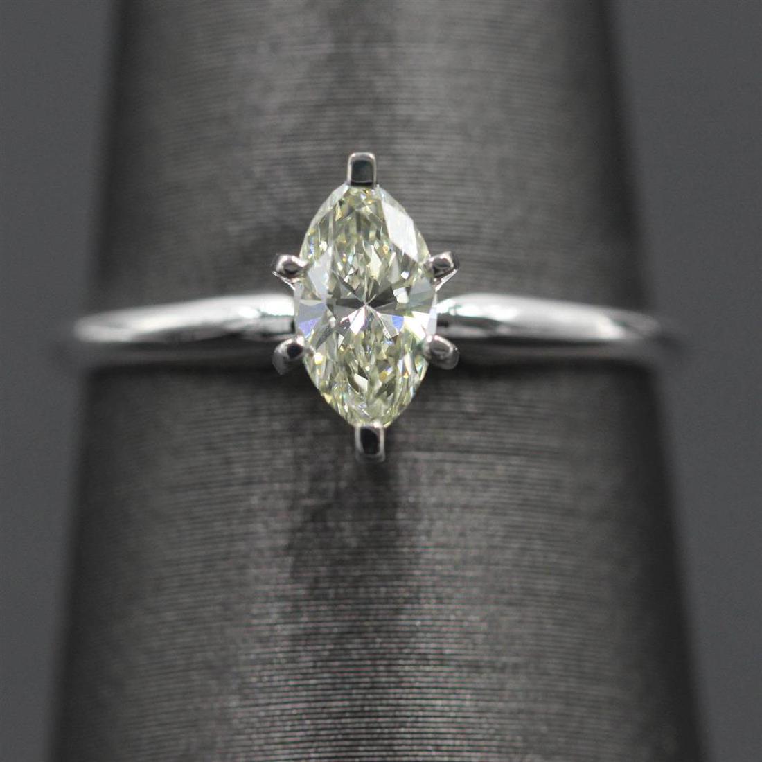 0.52 ctw Marquise Diamond Solitaire Ring - 14KT White: One lady's solitaire ring featuring: 14KT white gold weighing 1.75 grams containing one marquise cut diamond weighing 0.52ct. The diamond has VS1 clarity and H color with excellent cut.