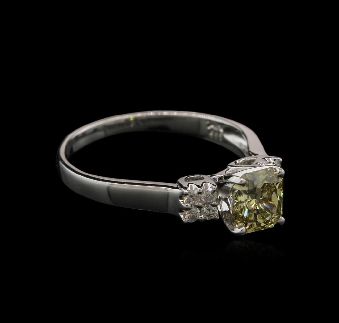 1.21 ctw Fancy Greenish Yellow Diamond Ring - 14KT: One electronically tested 14KT white gold ladies cast diamond engagement ring with a bright polish finish. Identified with markings of "14K". Condition is new. Containing: One prong set radiant shaped