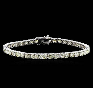 13.00 ctw Diamond Tennis Bracelet - 18KT White Gold: One 18KT white gold 13.00ctw diamond tennis bracelet. Metal: 18KT solid white gold. Face Measurements: 4.5 x 180mm. Size: 7. Finish: Bright polish. Total item weight: 15.50 grams. Markings: Stamped 18