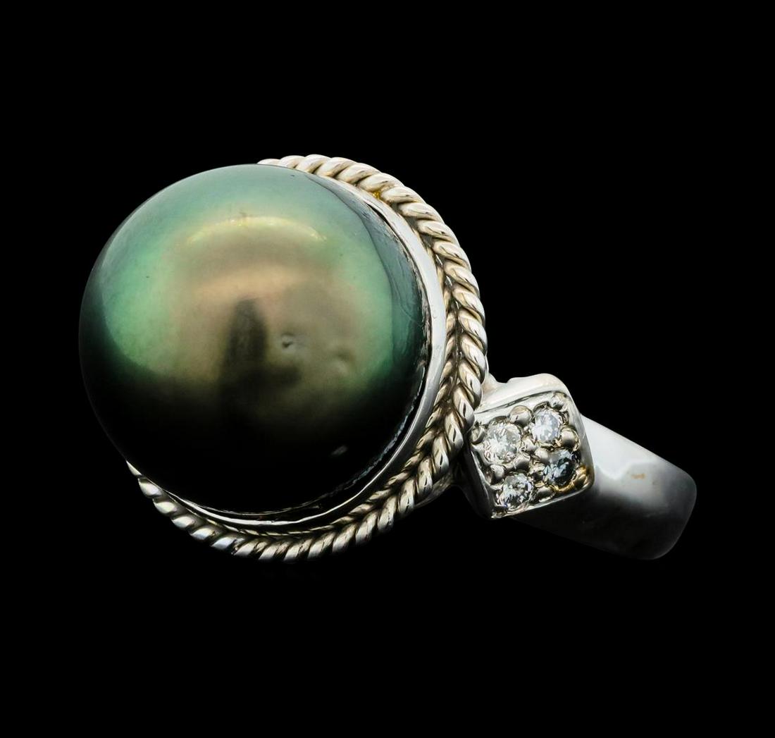 Tahitian Pearl and Diamond Ring - 14KT White Gold: One electronically tested 14KT white gold lady's cast fashion ring with a cathederal shank with a bright polish finish. Condition is new good workmanship. The featured lady's ring has a shank mexuring