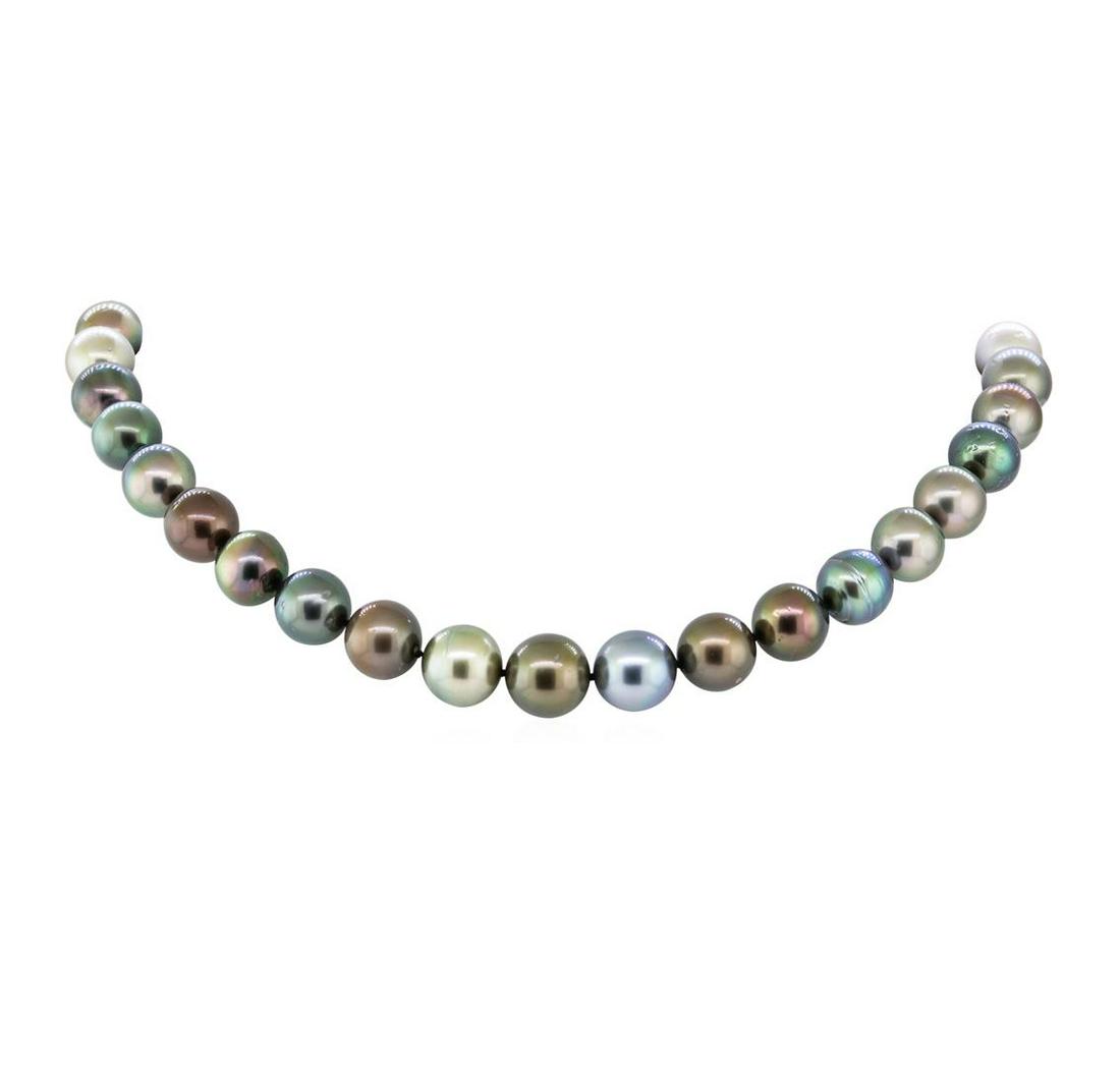 Tahitian Pearl Necklace - 14KT White Gold: One graduated, single strand cultured Tahitian pearl necklace. The strand has each pearl individually hand knotted and measures 18 inches in length. The necklace is finished with a scalloped 14KT whit