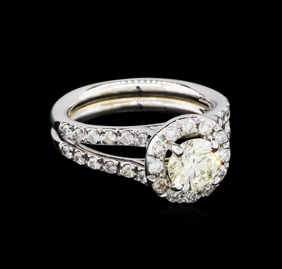 1.64 ctw Diamond Ring - 14KT White Gold: One electronically tested 14KT white gold lady's cast wedding ring with a split shank halo with a bright polish finish. The featured lady's ring has a double shank measuring 4.25 millimeters wide. Ide