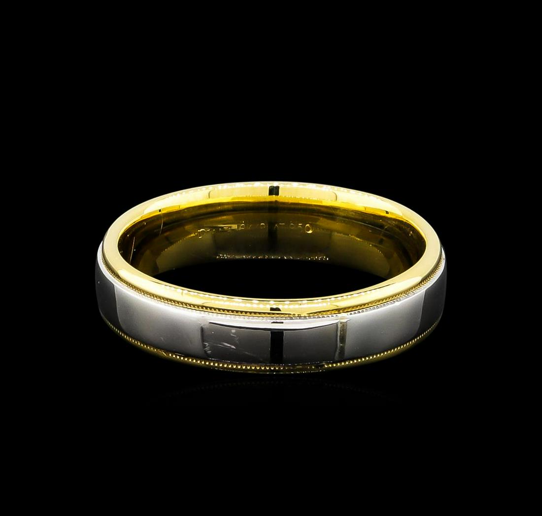 18KT Two-Tone Gold Ring: One ring featuring: 18KT yellow and platinum gold weighing 6.85 grams.