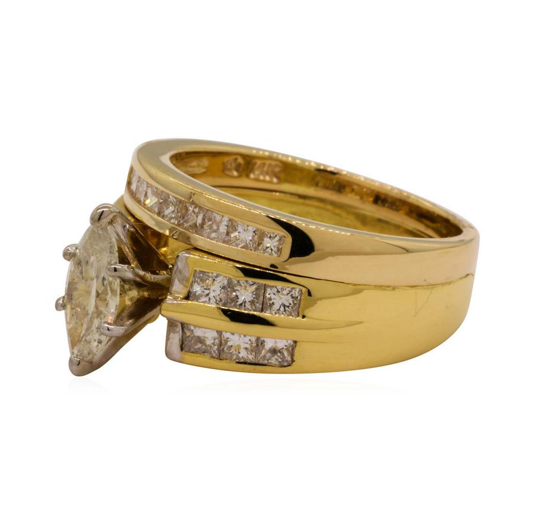 1.27 ctw Diamond Ring - 14-18KT Yellow Gold: One electronically tested 14-18KT yellow gold lady's combination cast & assembled wedding ring and attached band with a bright polish finish. The featured lady's ring has a double shank measuring 4.70