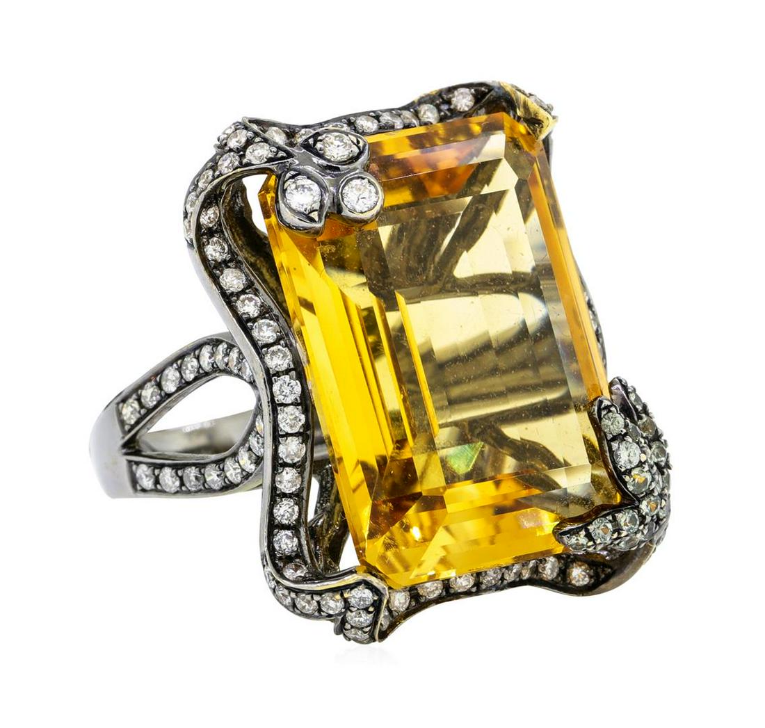 32.00 ctw Citrine And Diamond Ring - 18KT Black Rhodium: One electronically tested 18KT black rhodium gold lady's cast fashion ring with a split shank scalloped halo with a bright polish finish. The featured lady's ring has a shank measuring 3.16 millimeter