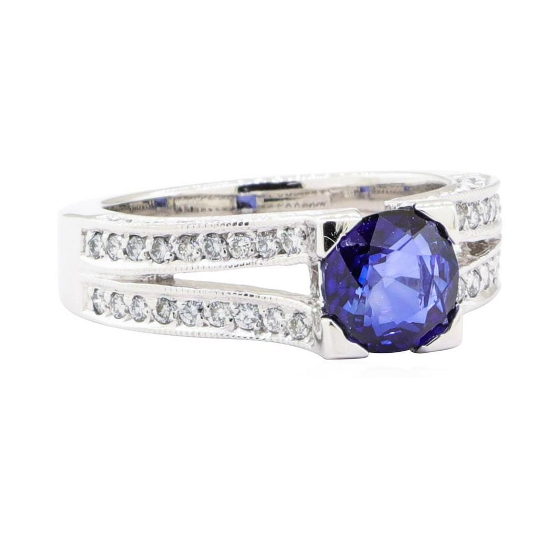 2.35 ctw Sapphire And Diamond Ring - 14KT White Gold: One electronically tested 14KT white gold lady's cast fashion ring with a split cathedral shank with a bright polish with milgrain detailing finish. The featured lady's ring has a shank measuring 3.70
