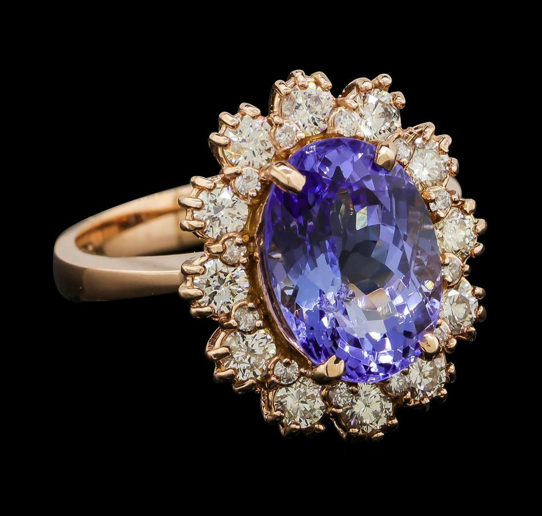 4.45 ctw Tanzanite and Diamond Ring - 14KT Rose Gold: One electronically tested 14KT rose gold lady's cast fashion ring with a basket halo with a bright polish finish. The featured lady's ring has a shank measuring 2.98 millimeters wide. Identified with 