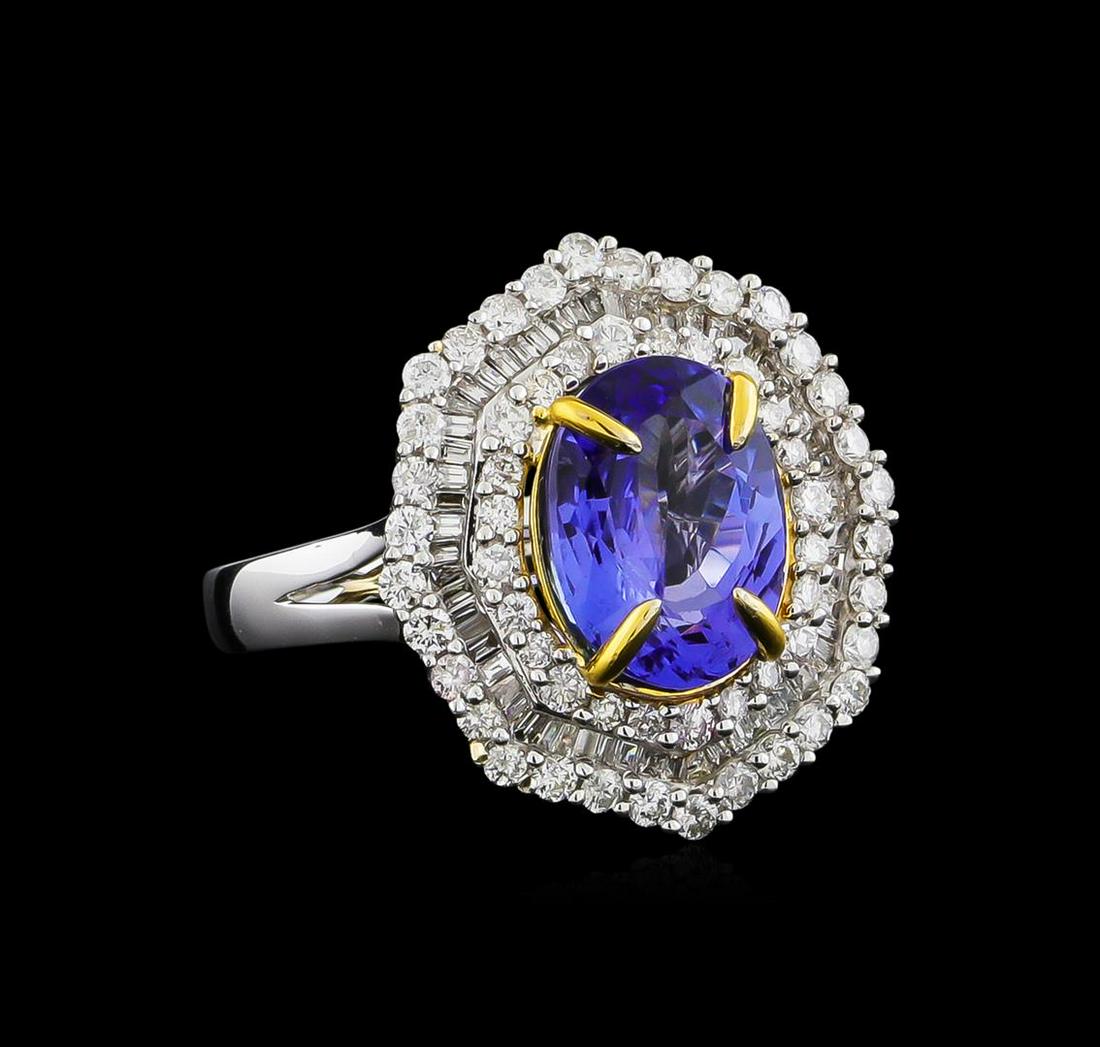 14KT Two-Tone Gold 2.63 ctw Tanzanite and Diamond Ring: One electronically tested 14KT white and yellow gold ladies combination cast & assembled tanzanite and diamond ring with a split shank with a bright polish finish. Identified with markings of "14K". C