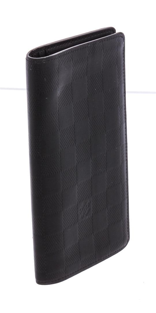 Louis Vuitton Damier Graphite Canvas Leather Brazza: Grey Damier Graphite coated canvas Louis Vuitton Brazza wallet with silver-tone hardware, leather lining featuring 12 card slots and six slit pockets and fold-over closure.