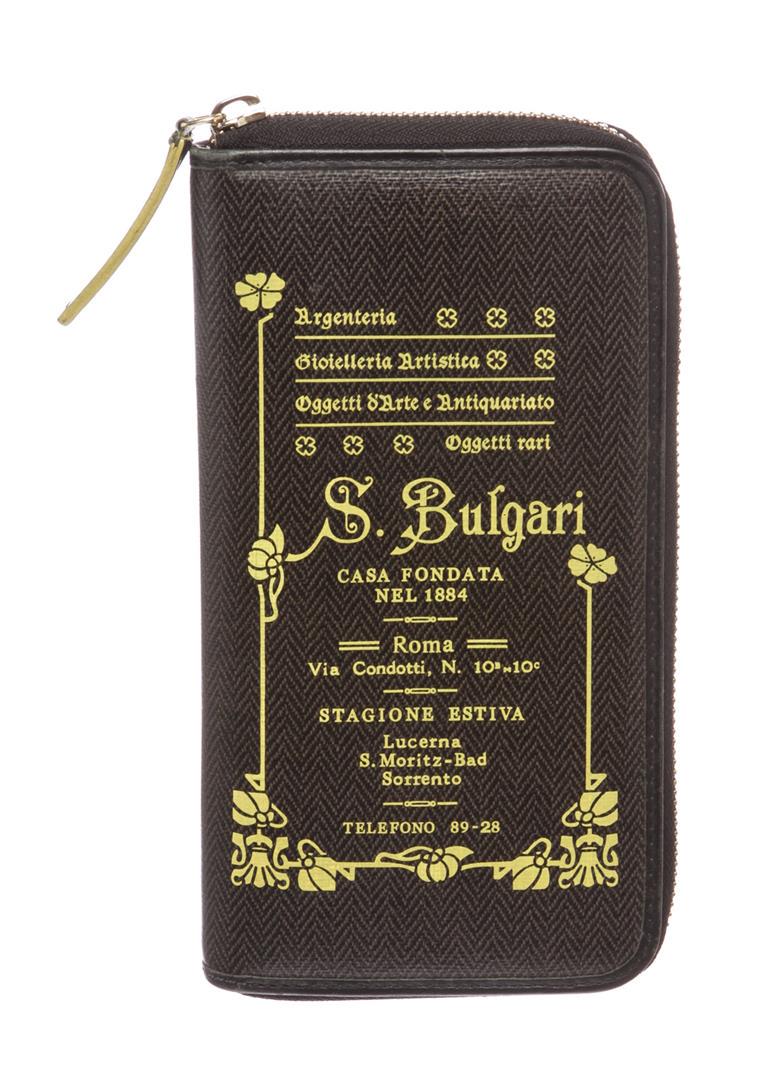 Bvlgari Dark Green Coated Canvas Graphic Print Zip: Overall zip around closure. Interior is leather lined and includes two compartments, one zipper pocket, six credit card slip pockets and two billfold pockets.