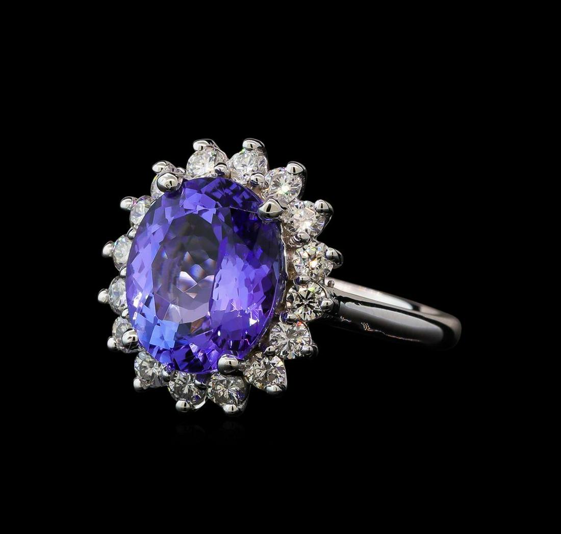 5.27 ctw Tanzanite and Diamond Ring - 14KT White Gold: One electronically tested 14KT white gold lady's cast fashion ring with a basket halo with a bright polish finish. The featured lady's ring has a shank measuring 2.21 millimeters wide. Identified with