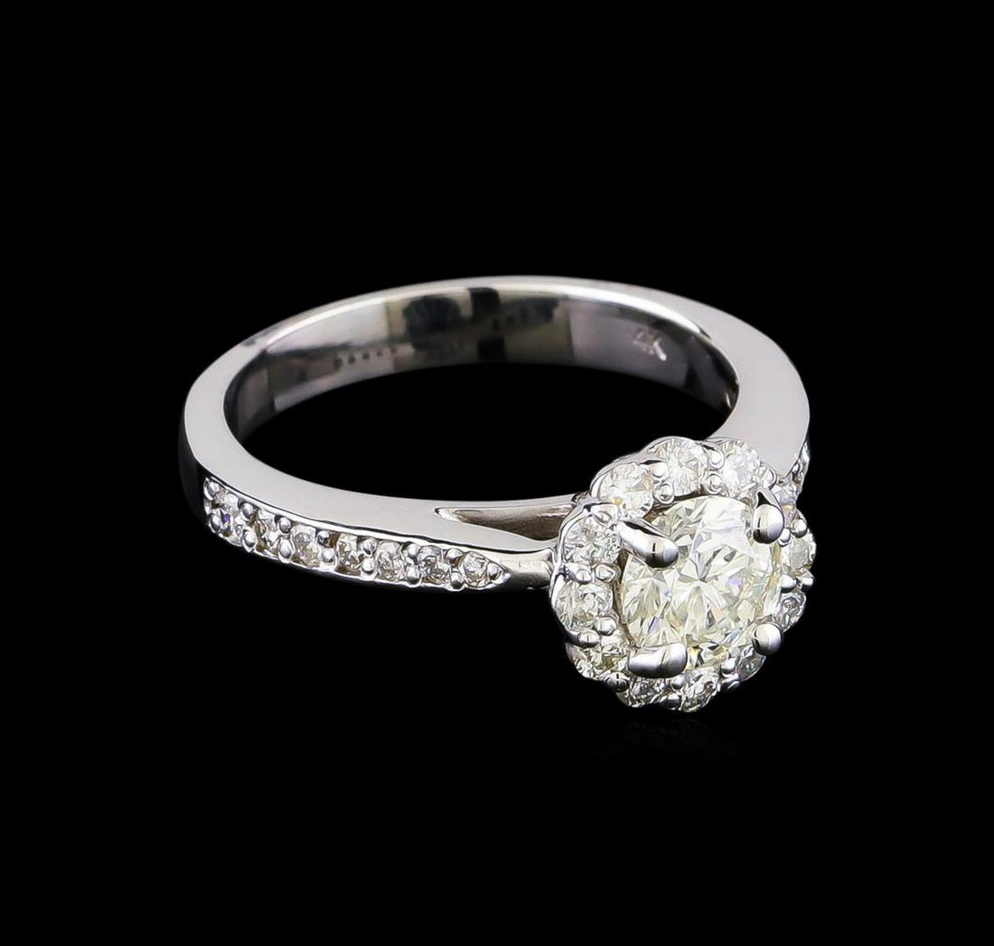 1.22 ctw Diamond Ring - 14KT White Gold: One electronically tested 14KT white gold lady's combination cast & assembled wedding ring with a basket halo with cathedral shank with a bright polish finish. The featured lady's ring has a shank mea