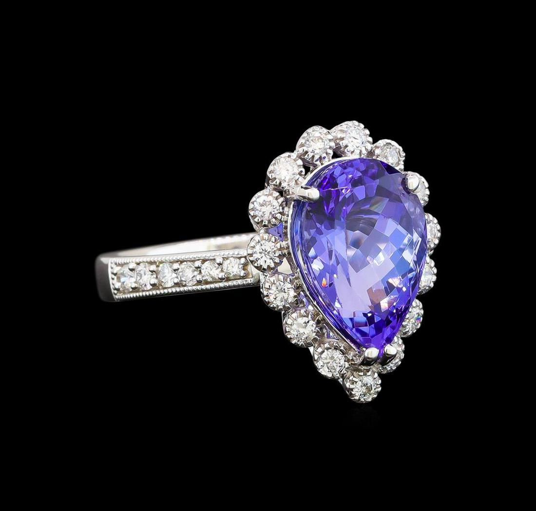 14KT White Gold 3.73 ctw Tanzanite and Diamond Ring: One electronically tested 14KT white gold ladies cast tanzanite and diamond ring with a flat shank with a bright polish finish. Trademark is Orianne. Identified with markings of "14K". Condition is ne
