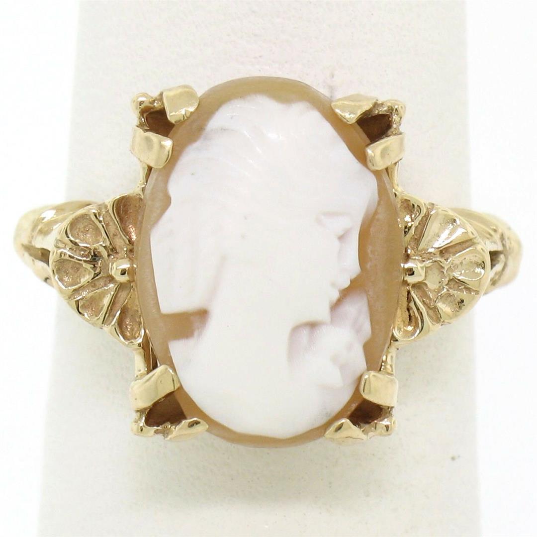 Vintage 14kt Yellow Gold Carved Shell Cameo Floral Ring: A vintage 14kt yellow gold solitaire ring featuring a carved shell cameo measuring approximately 14x10mm. The ring is size 6.0, weighs a total of 3.76 grams, and measures 14.0mm wide.