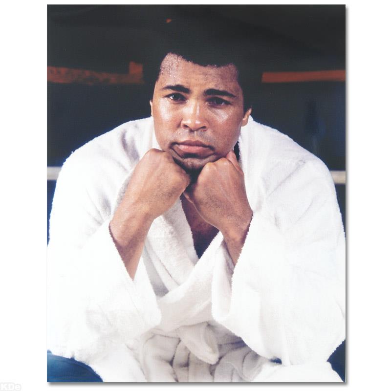 Ali with white robe by Ali, Muhammad: Own a piece of sports history with this Muhammad Ali photo. Taken at the peak of his success as one of the greatest heavyweight championship boxers of all time, this photo is sure to complement any sp