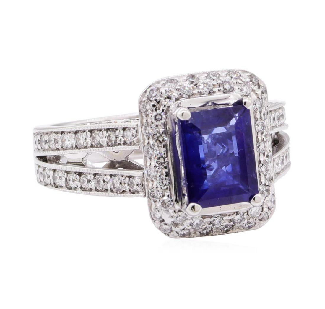 2.97 ctw Blue Sapphire And Diamond Ring - 14KT White: One electronically tested 14KT white gold lady's cast fashion ring with a split cathedral shank with a halo with a bright polish with milgrain detailing finish. The featured lady's ring has a shank me