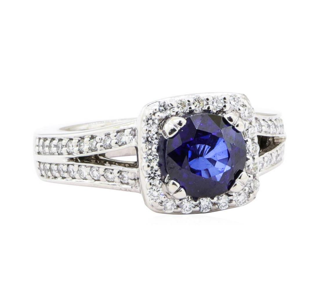 2.28 ctw Sapphire And Diamond Ring - 14KT White Gold: One electronically tested 14KT white gold lady's cast fashion ring with a split shank halo with a bright polish finish. The featured lady's ring has a shank measuring 3.30 millimeters wide. Trademark 