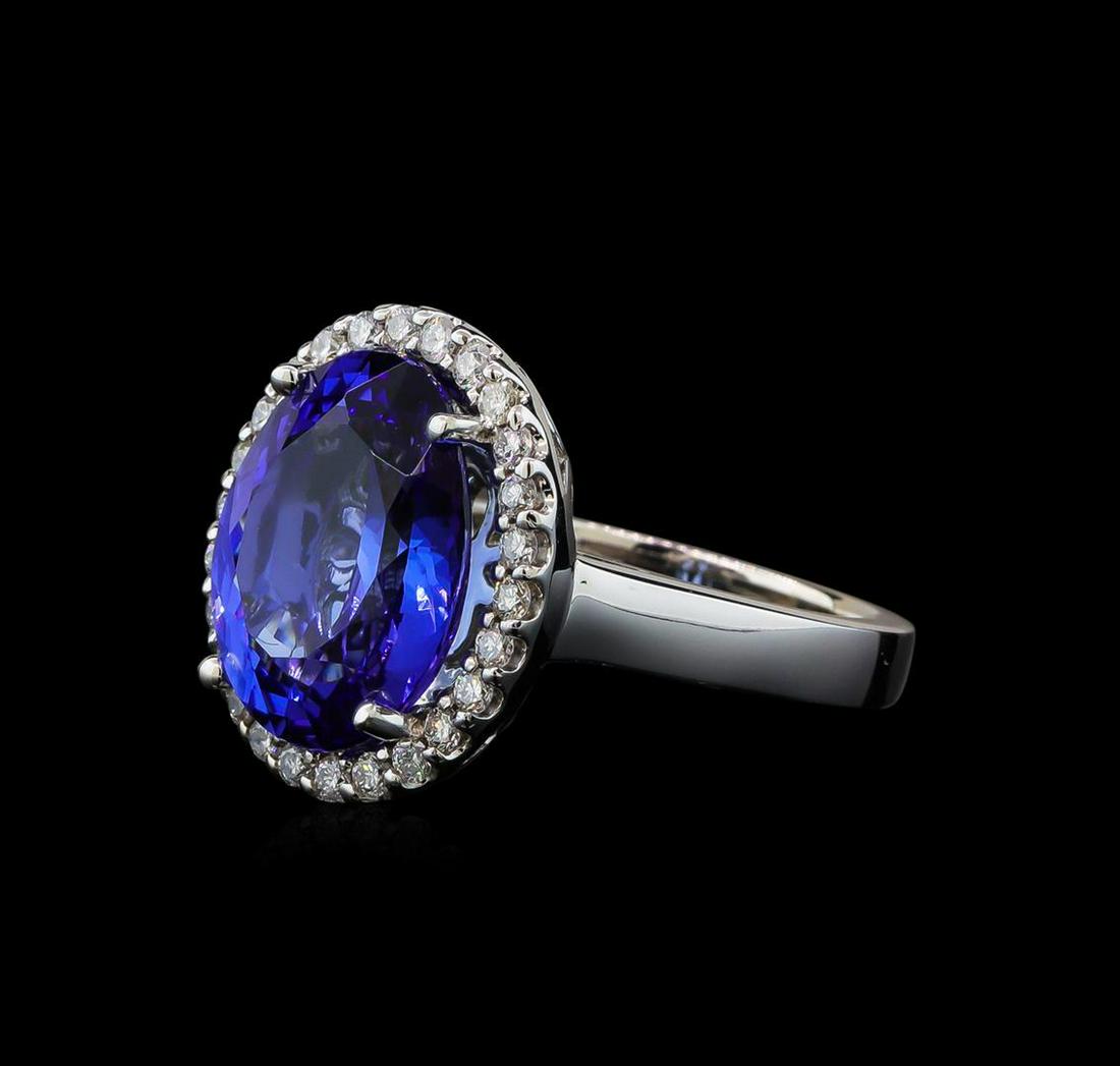 7.98 ctw Tanzanite and Diamond Ring - 14KT White Gold: One electronically tested 14KT white gold lady's cast fashion ring with a basket halo with a bright polish finish. The featured lady's ring has a shank measuring 2.91 millimeters wide. Identified with