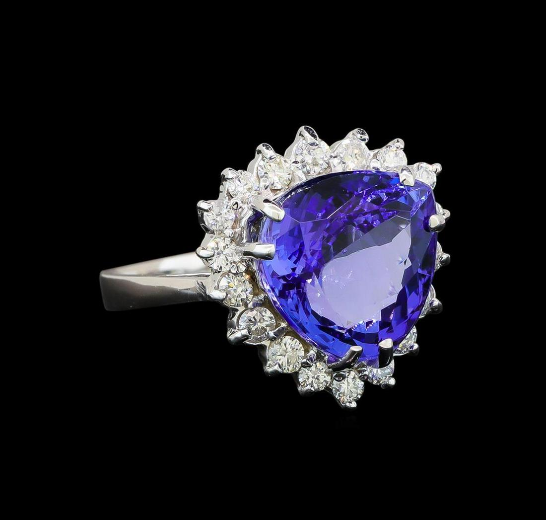 14KT White Gold 6.78 ctw Tanzanite and Diamond Ring: One electronically tested 14KT white gold ladies cast tanzanite and diamond ring with a bright polish finish. Identified with markings of "14K". Condition is new. Containing: One prong set triangle mo