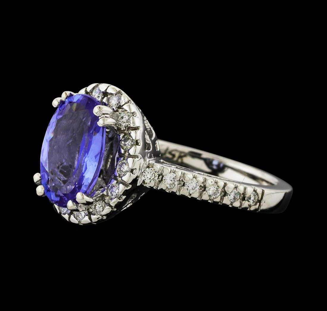 2.80 ctw Tanzanite and Diamond Ring - 14KT White Gold: One Tanzanite and Diamond Ring featuring: 14KT White Gold with a total weight of 5.96 grams, Tanzanite with a total weight of 2.80ct, and 26 diamonds with a total weight of 0.38ctw.