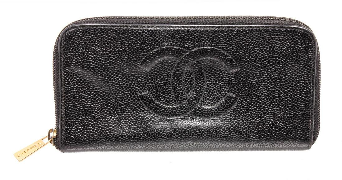 Chanel Black Caviar Leather Timeless Zippy Wallet: Chanel black Caviar leather timeless long wallet with gold-tone hardware, black fabric lining, dual interior compartments, each with bill pocket and 2 card slots, zip around closure.