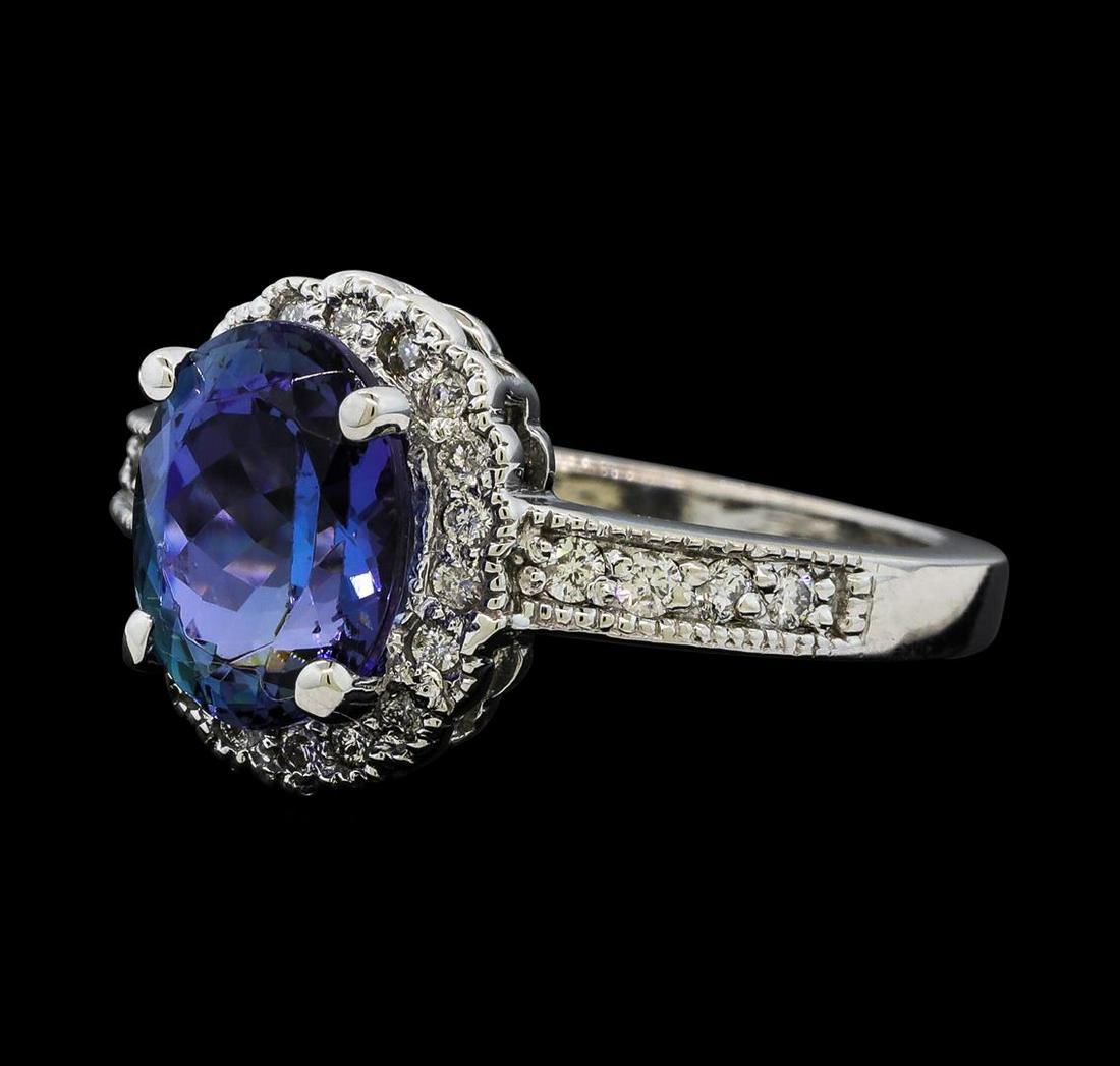 2.65 ctw Tanzanite and Diamond Ring - 14KT White Gold: One Tanzanite and Diamond Ring including: 14KT White Gold weighing a total of 4.63 grams, Tanzanite weighing a total of 2.65ct, and 26 Diamonds weighing a total of 0.28ctw.