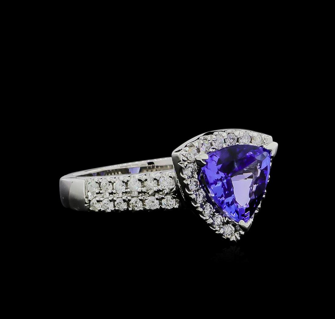 1.90 ctw Tanzanite and Diamond Ring - 14KT White Gold: One ring featuring: 14KT white gold weighing 5.85 grams containing one tanzanite with a total weight of 1.90ct and side diamonds with a total weight of 0.50ct.