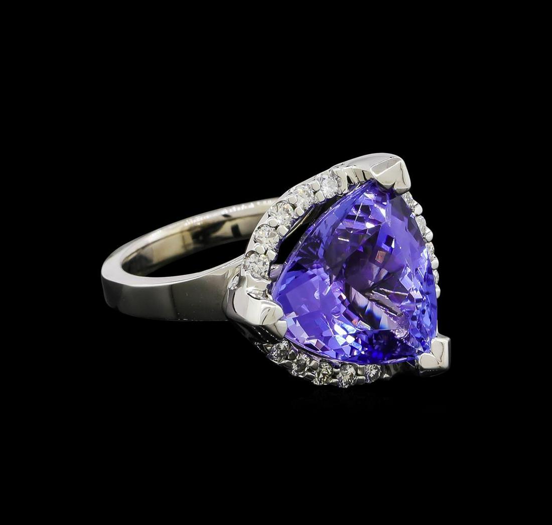 9.25 ctw Tanzanite and Diamond Ring - 14KT White Gold: One electronically tested 14KT white gold lady's cast fashion ring with a cathedral halo with a bright polish finish. The featured lady's ring has a shank measuring 2.70 millimeters wide. Identified w