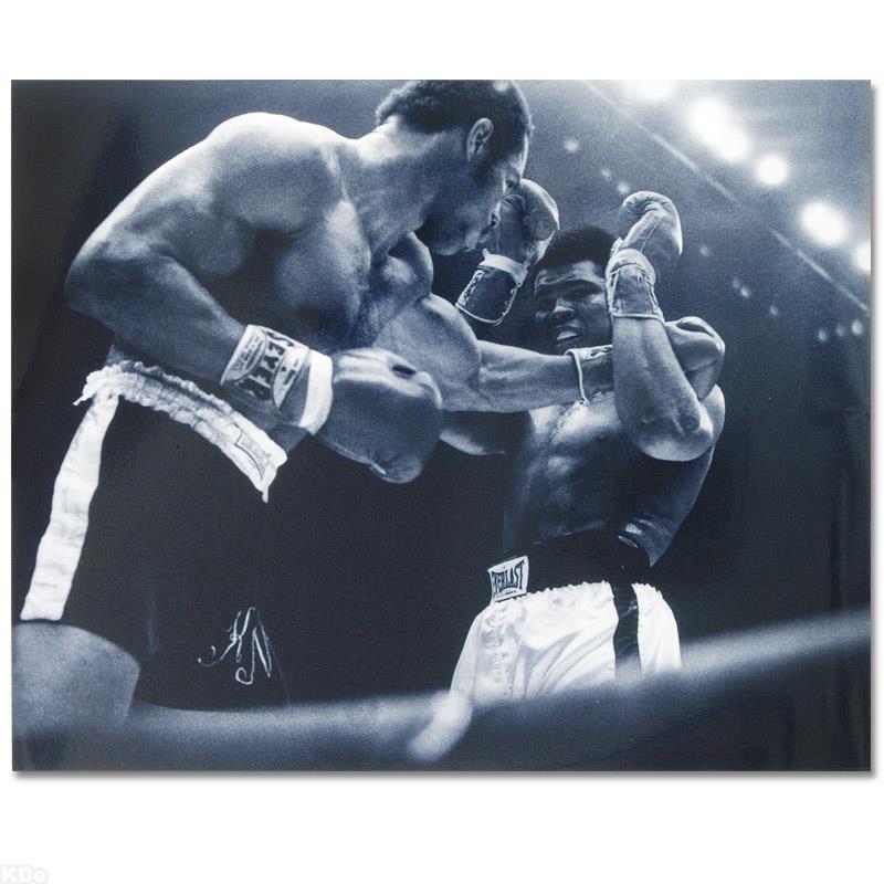 Ali and Norton Black And White by Ali, Muhammad: Own a piece of sports history with this Muhammad Ali and Ken Norton photo. Taken at the peak of his success as one of the greatest heavyweight championship boxers of all time, this photo is sure to co