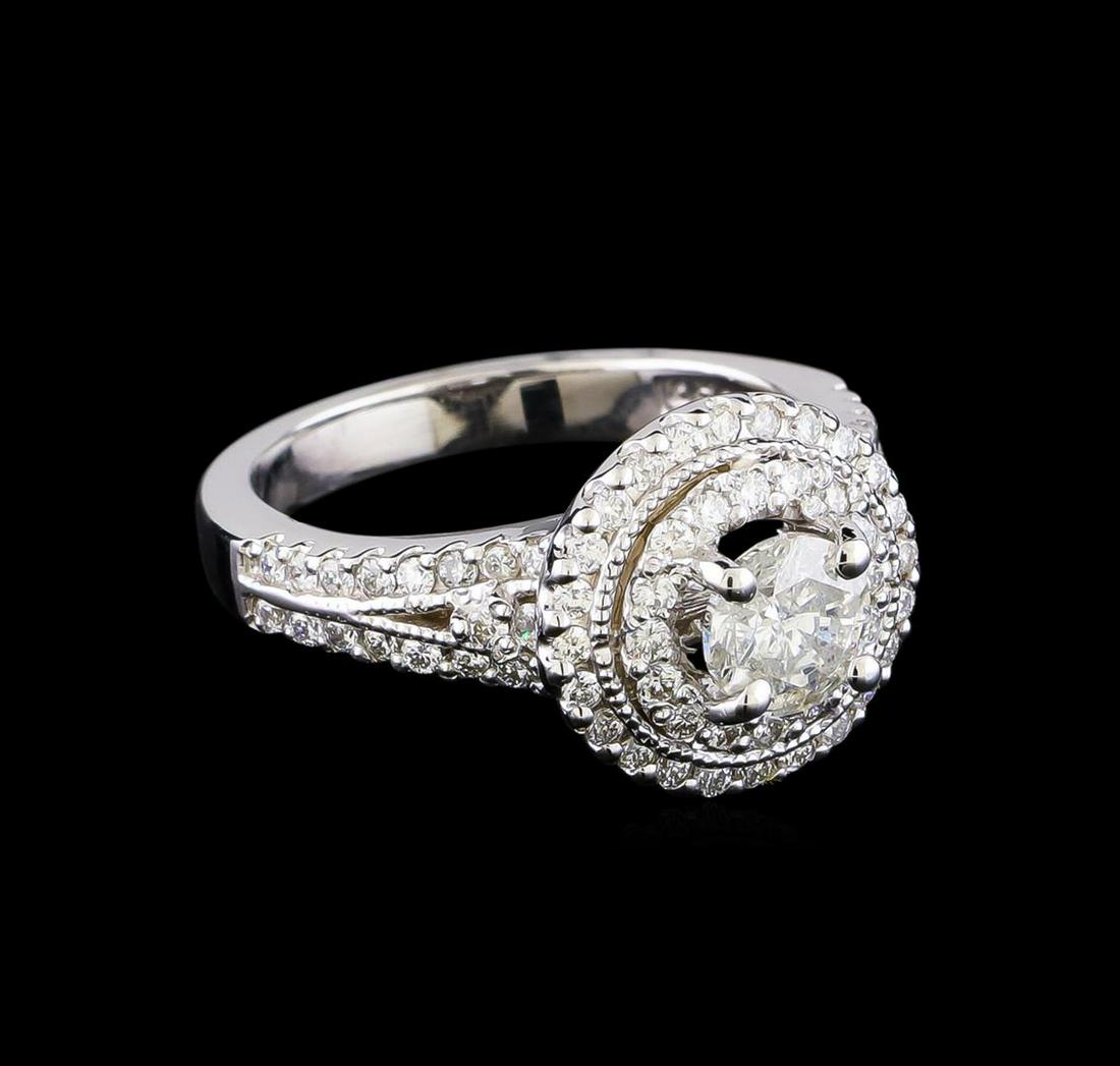 1.33 ctw Diamond Ring - 14KT White Gold: One electronically tested 14KT white gold lady's cast wedding ring with a double halo with a bright polish finish. The featured lady's ring has a shank measuring 2.58 millimeters in width. Identified