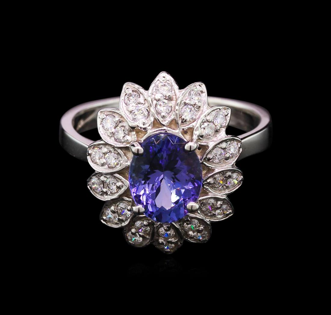 2.00 ctw Tanzanite and Diamond Ring - 14KT White Gold: One ring featuring: 14KT white gold weighing 4.82 grams containing one tanzanite with a total weight of 2.00ct and 28 diamonds with a total weight of 0.43ct.