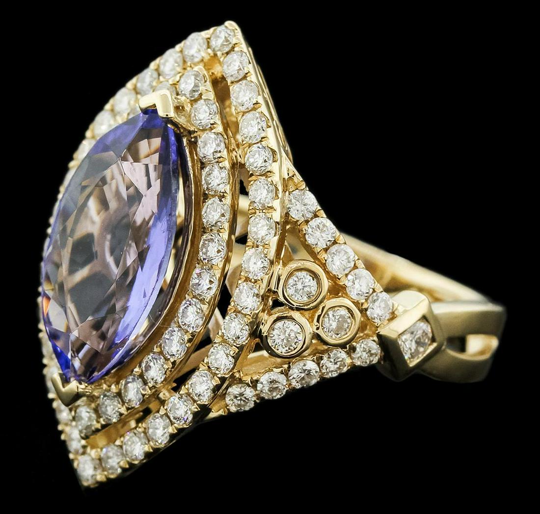 14KT Yellow Gold 10.41 ctw Tanzanite and Diamond Ring: One electronically tested 14KT yellow gold ladies cast tanzanite and diamond ring with a bright polish finish. Identified with markings of "14K". Condition is new. Containing: One prong set marquise m