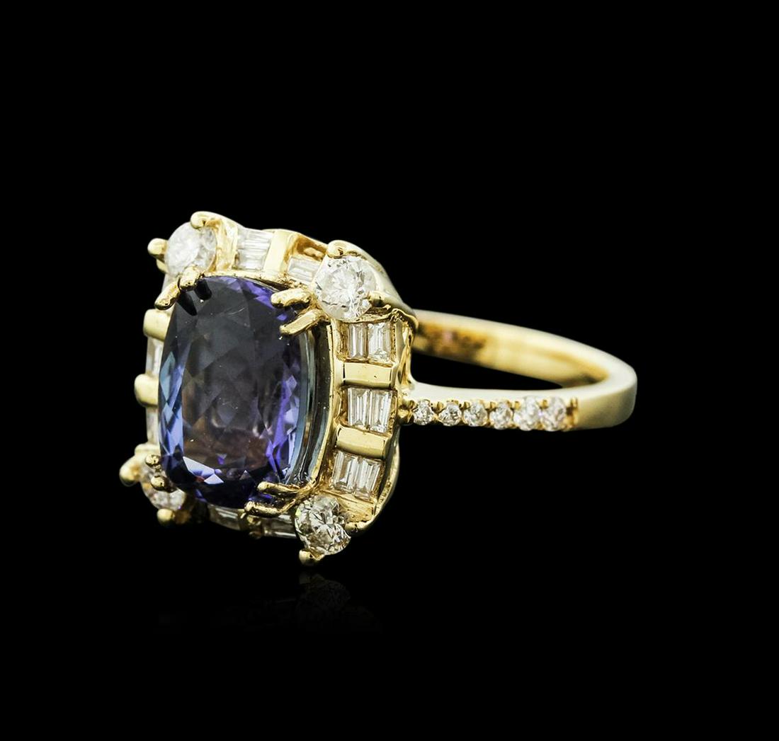 14KT Yellow Gold 3.61 ctw Tanzanite and Diamond Ring: One electronically tested 14KT yellow gold ladies cast tanzanite and diamond ring with a bright polish finish. Identified with markings of "14K". Condition is new. Containing: One prong set rectangula