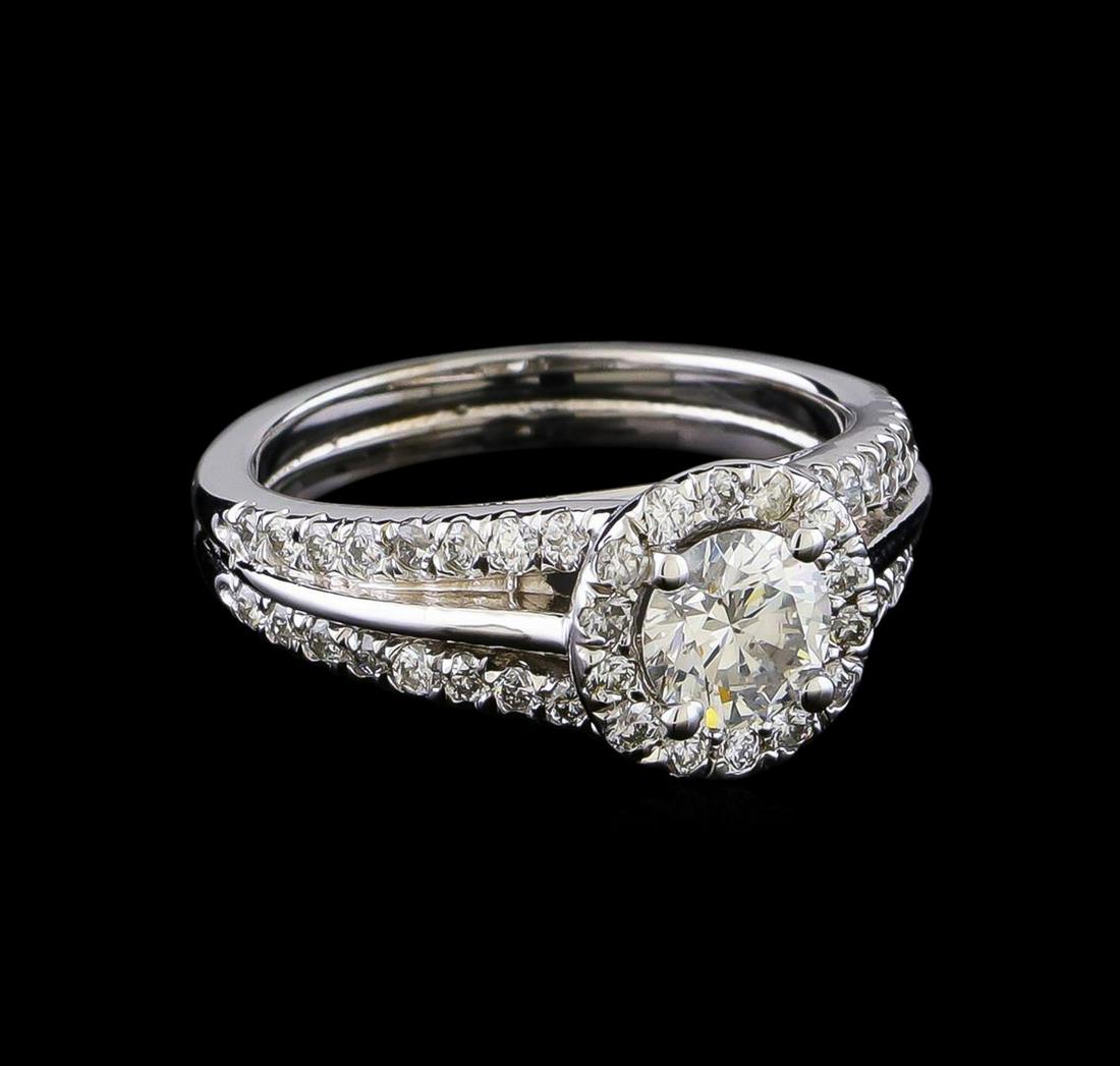 1.16 ctw Diamond Ring - 14KT White Gold: One electronically tested 14KT white gold lady's cast wedding ring with a split shank cathedral halo with a bright polish finish. The featured lady's ring has a double shank measuring 3.0 millimeters
