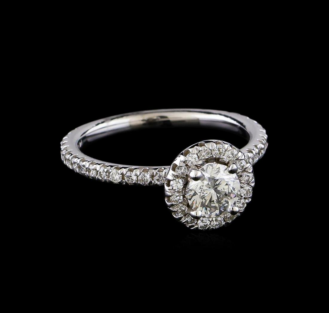 1.08 ctw Diamond Ring - 14KT White Gold: One electronically tested 14KT white gold lady's cast wedding ring with a halo with a bright polish finish. The featured lady's ring has a shank measuring 1.92 millimeters in width. Identified with ma