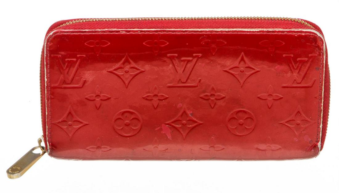Louis Vuitton Red Vernis Monogram Zippy Wallet: Red Vernis leather Louis Vuitton Zippy wallet with gold-tone hardware, tonal leather lining, four interior compartments; one with zip closure, three bill compartments, eight card slots and zip-around