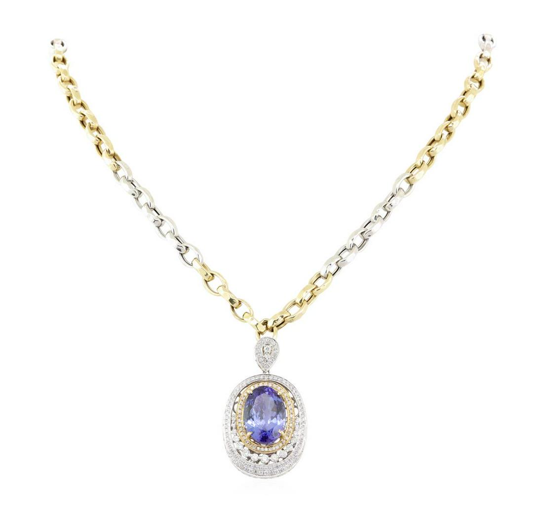 14.17 ctw Tanzanite and Diamond Pendant With Chain -: One electronically tested 14KT white gold ladies tanzanite and diamond pendant/enhancer with chain. The pendant/enhancer features a tanzanite set within a two tiered diamond lattice gallery, completed