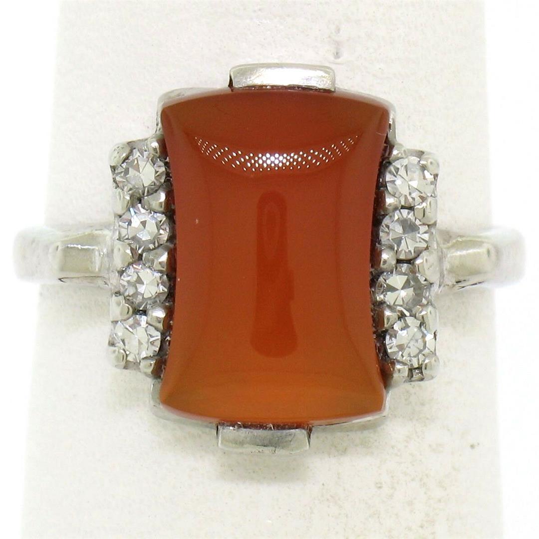 Antique 10K White Gold Carnelian Solitaire Ring w/ .22: One Antique 10K White Gold Carnelian Solitaire Ring w/ .22ctw Round Diamond Accents. Item Details: Material: 10K Solid White Gold, Weight: 3.14 Grams, Stone(s): (1) Natural Genuine Carnelian - Hourgla